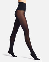 a woman in a short skirt on a beach