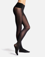 a woman in a bikini standing on top of a beach